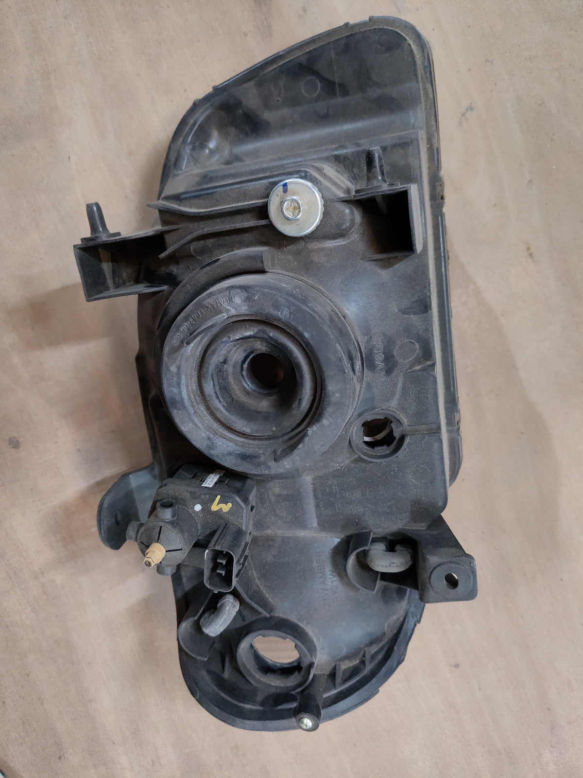 Maruti Suzuki Alto Minor headlamp with model number 35321M79G40, shown as a clear vehicle headlight in the image.