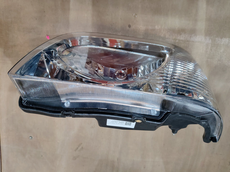 Maruti Suzuki unit headlamp LH 35320M78L01 with clear lens and mounting brackets, designed for vehicle illumination.