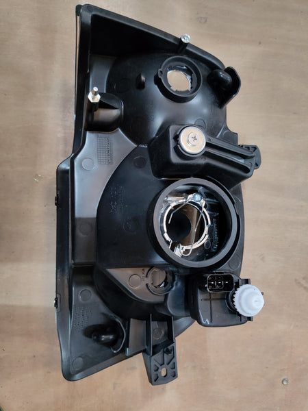 Maruti Suzuki headlamp LH 35320M78L01 showing the front view with clear lens and headlight components.
