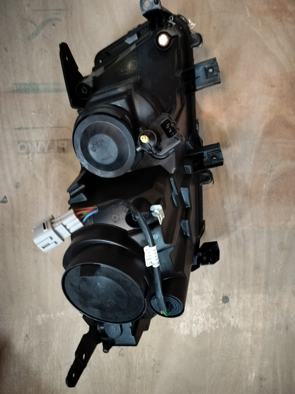 Maruti Suzuki Vitara Brezza petrol unit headlamp LH for model 35321M82P13, close-up view of the vehicle's headlight assembly.