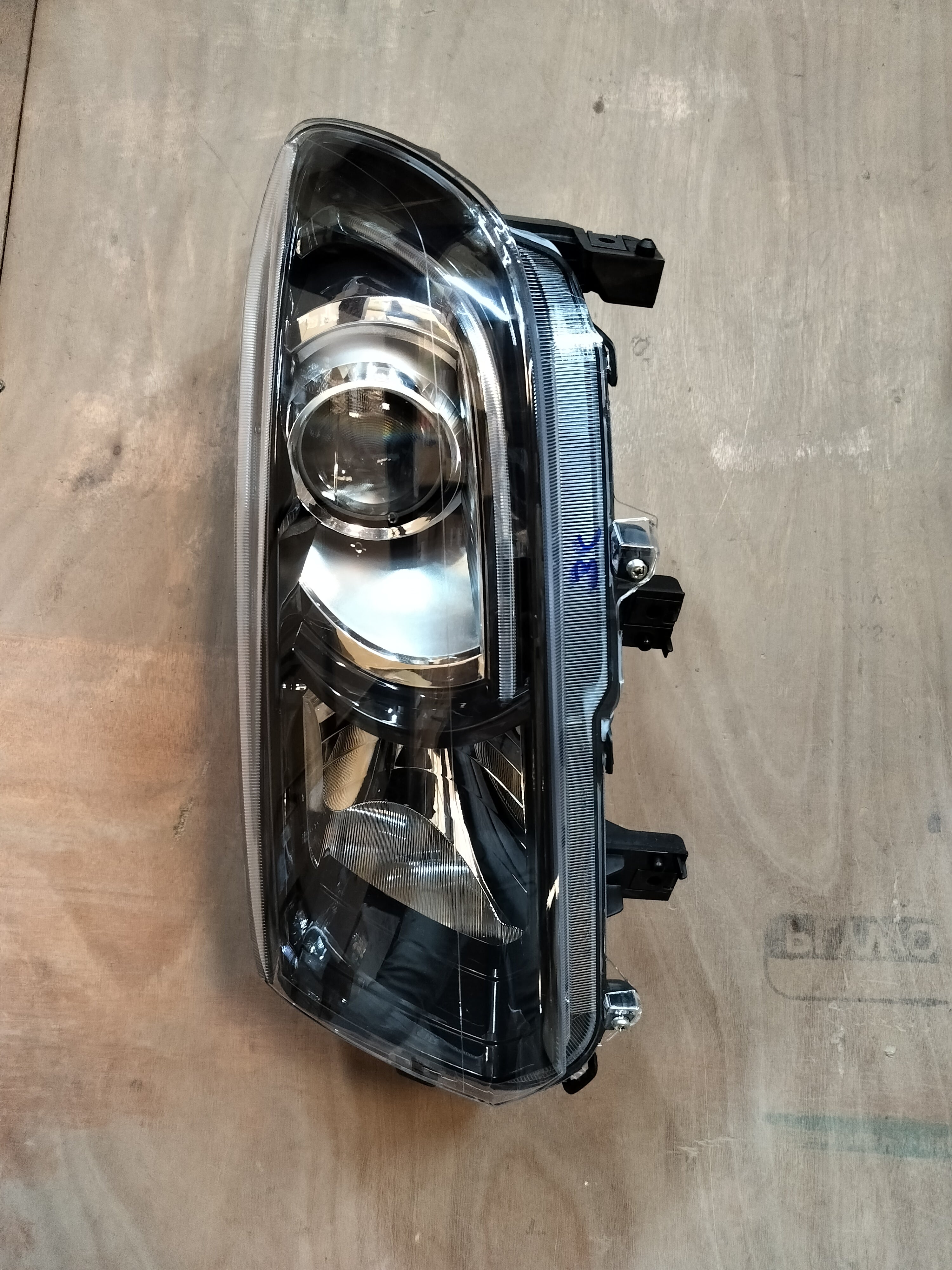 Maruti Suzuki Vitara Brezza petrol headlamp unit LH for model 35321M82P13, showing the automotive headlight assembly.