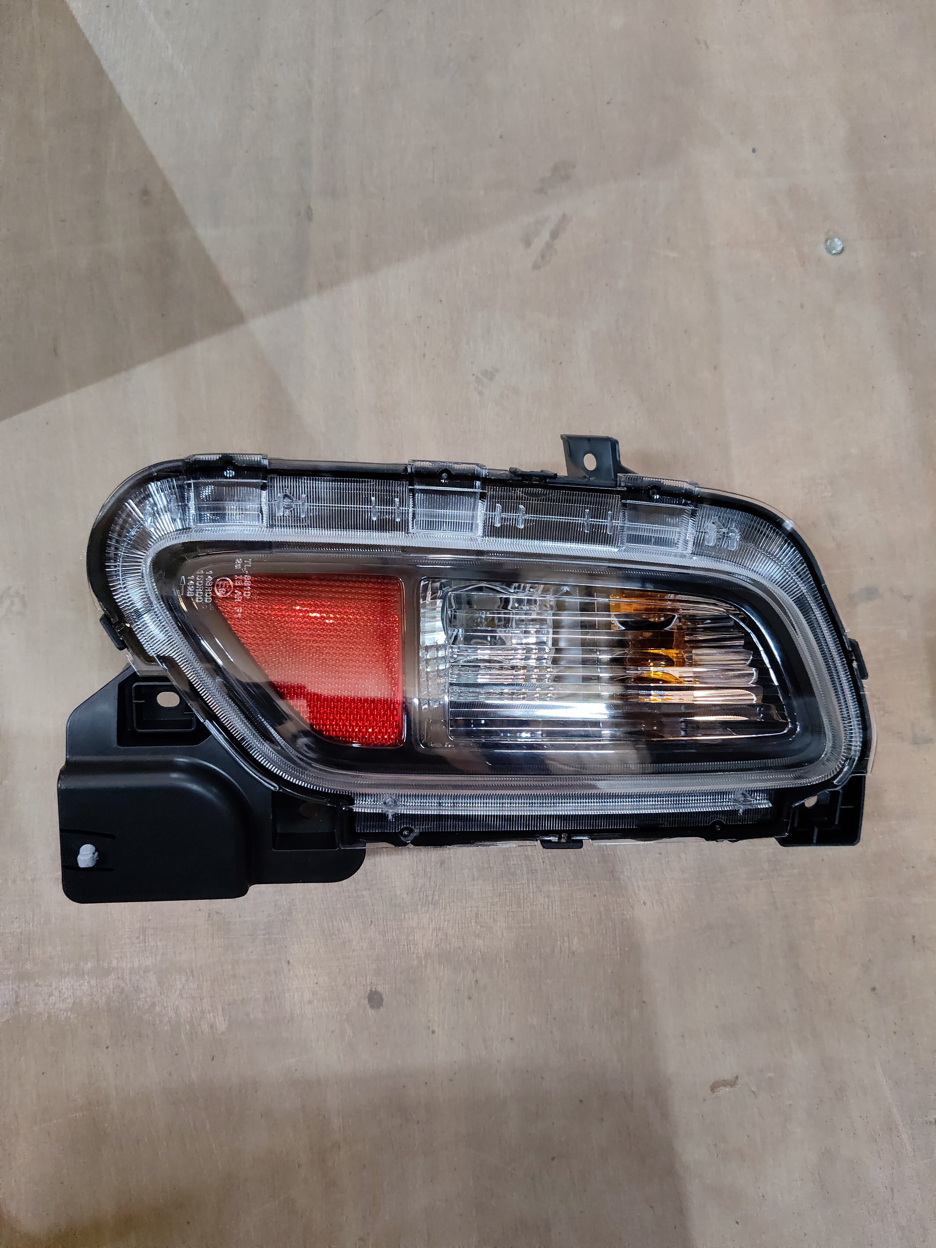 Maruti Suzuki Unitrear Combl 35670M76T00 part for vehicle, showing the black automotive component with detailed design.