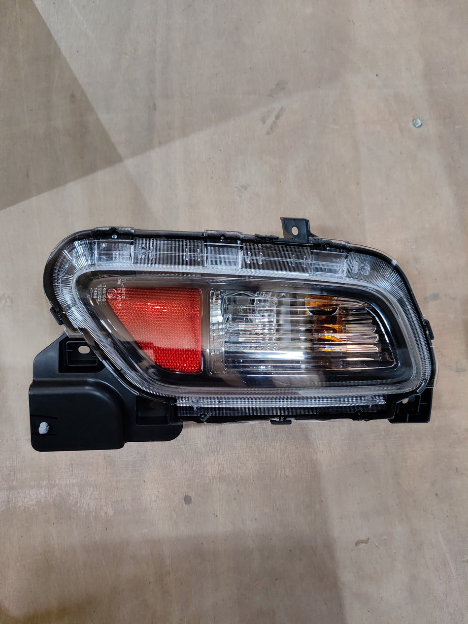 Maruti Suzuki Unitrear Combl 35670M76T00 part for vehicle, showing the black automotive component with detailed design.