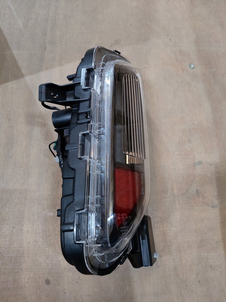Maruti Suzuki Unitrear Combl 35670M76T00, automotive part for Maruti Suzuki vehicles, showing the black plastic component.