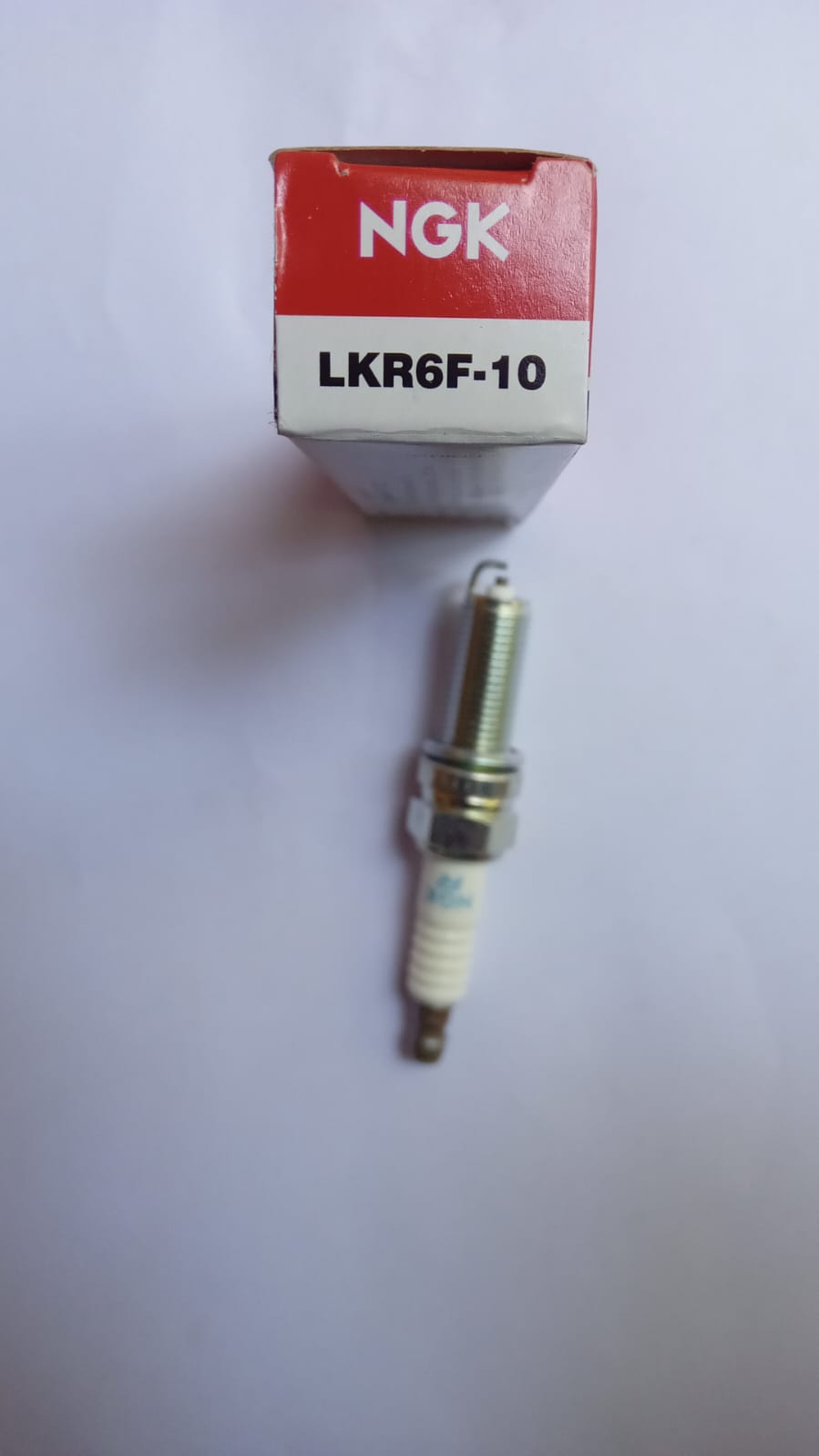 NGK spark plug for Hyundai Xcent petrol engine, model LKR6F10, with visible metal and ceramic insulator in the image.