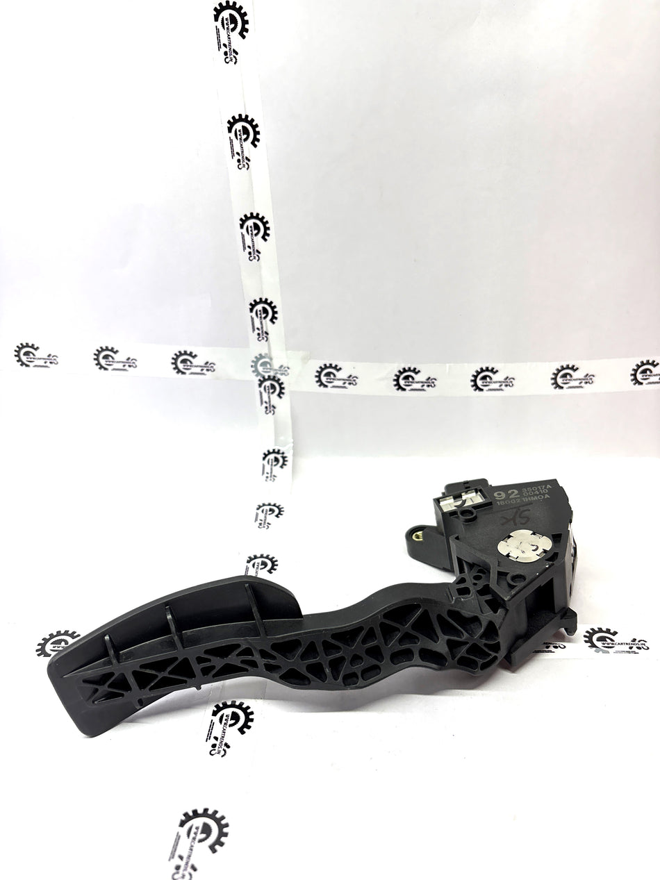 Nissan accelerator lever part 180021HM0A, close-up of the vehicle accelerator control lever in black plastic