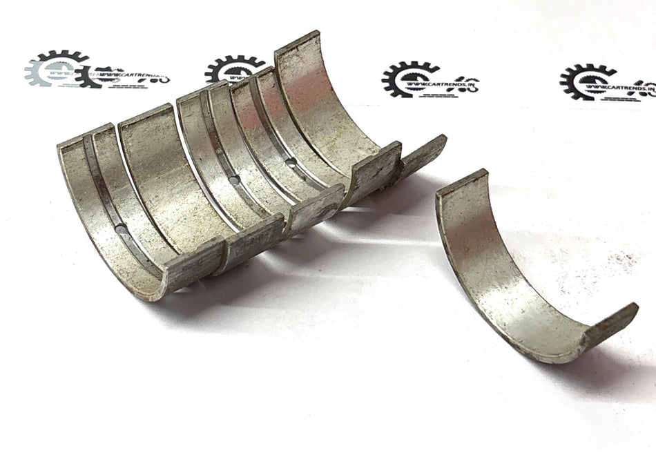 Nissan Micra bushing set, car suspension parts, black rubber bushings shown in close-up for vehicle stability and control.