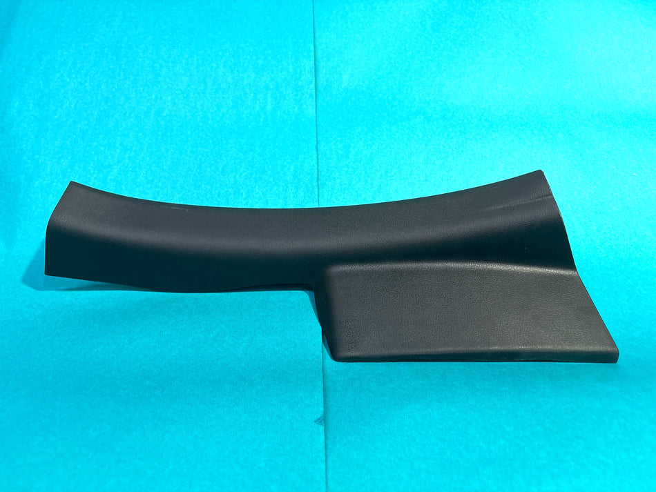 Nissan Micra kick plate assembly in black with silver Nissan logo, installed on the car door sill area.