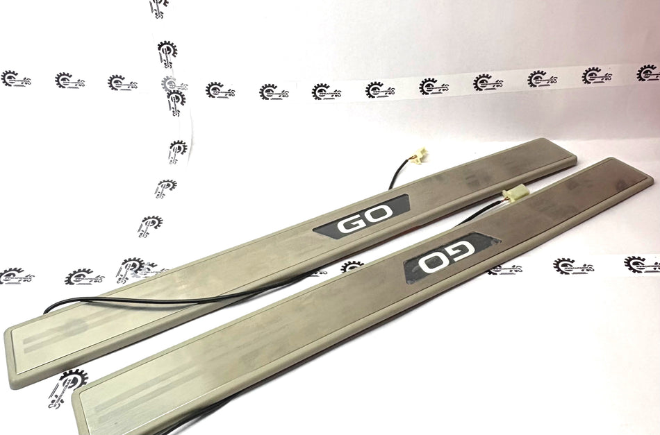 Nissan Datsun Go LED scuff plate with illuminated design, black finish, and branding detail for vehicle interior protection.