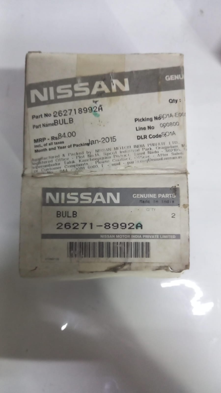Nissan bulb 262718992A, automotive headlight or interior bulb, with the Nissan logo visible on the packaging.