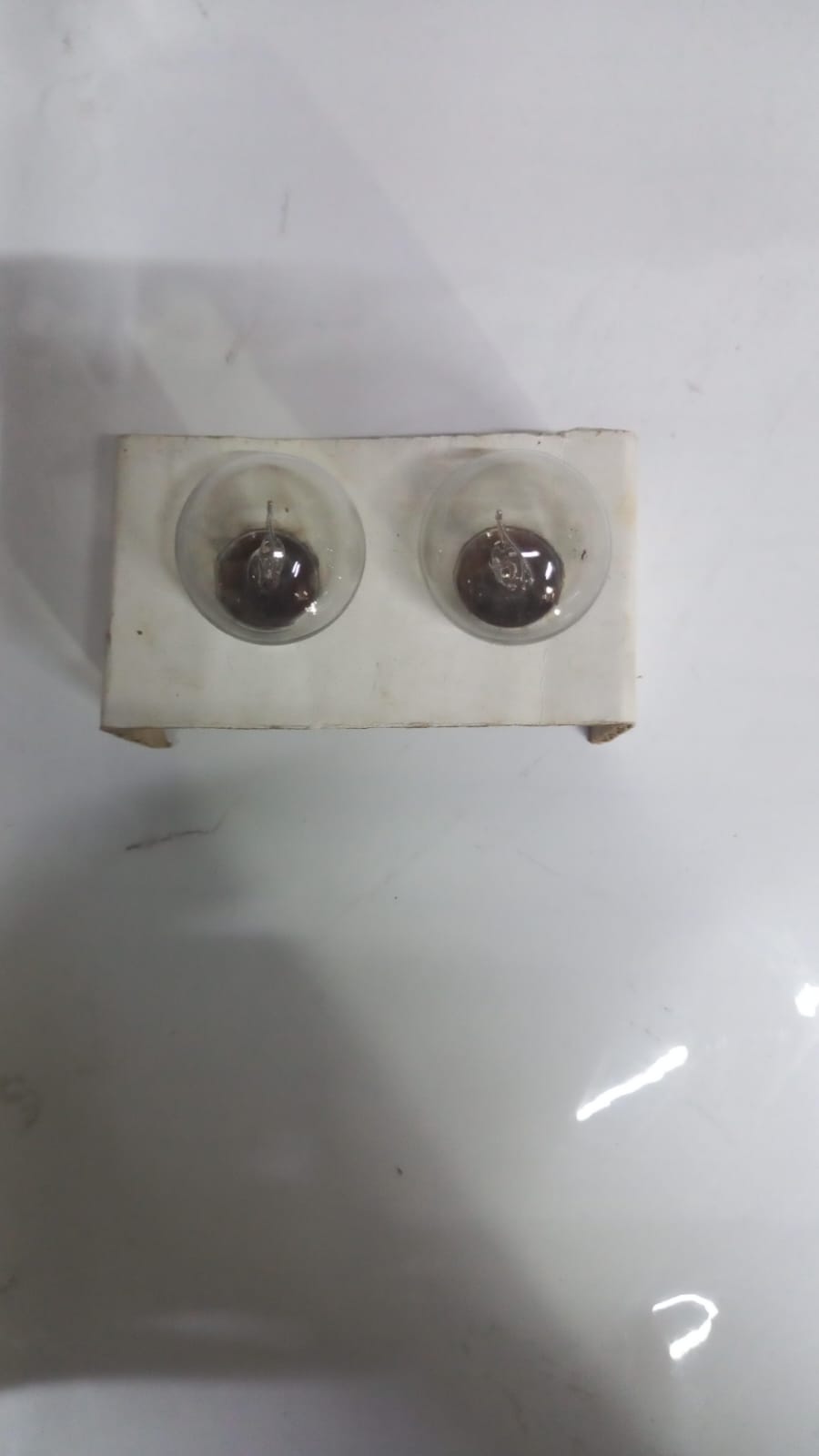 Nissan BULB 262718992A, automotive replacement bulb for Nissan vehicles, shown in a close-up view.