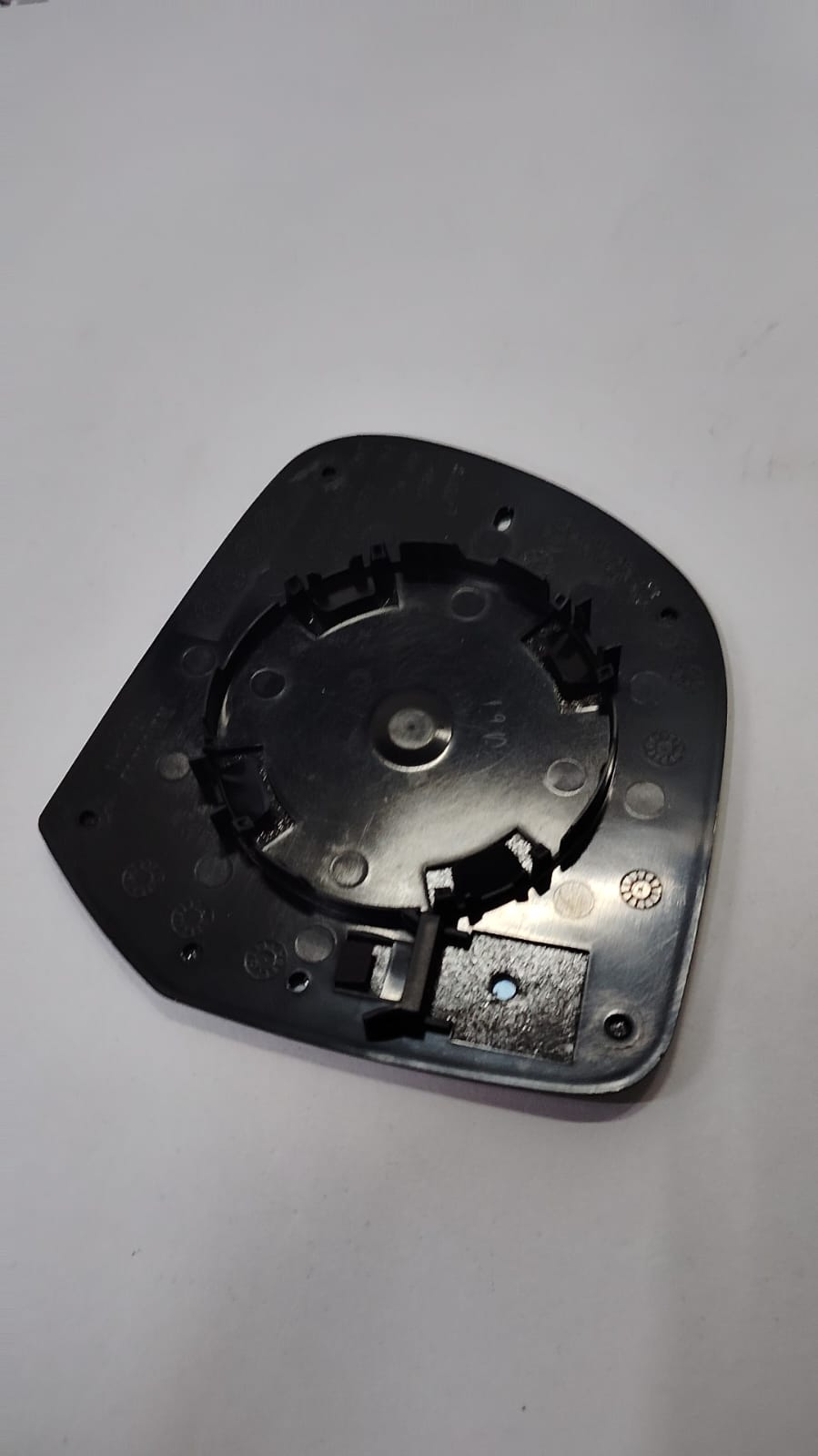 Nissan Duster mirror Tukdi part, black plastic exterior side mirror for Nissan Duster vehicle, showing the mirror housing and glass.