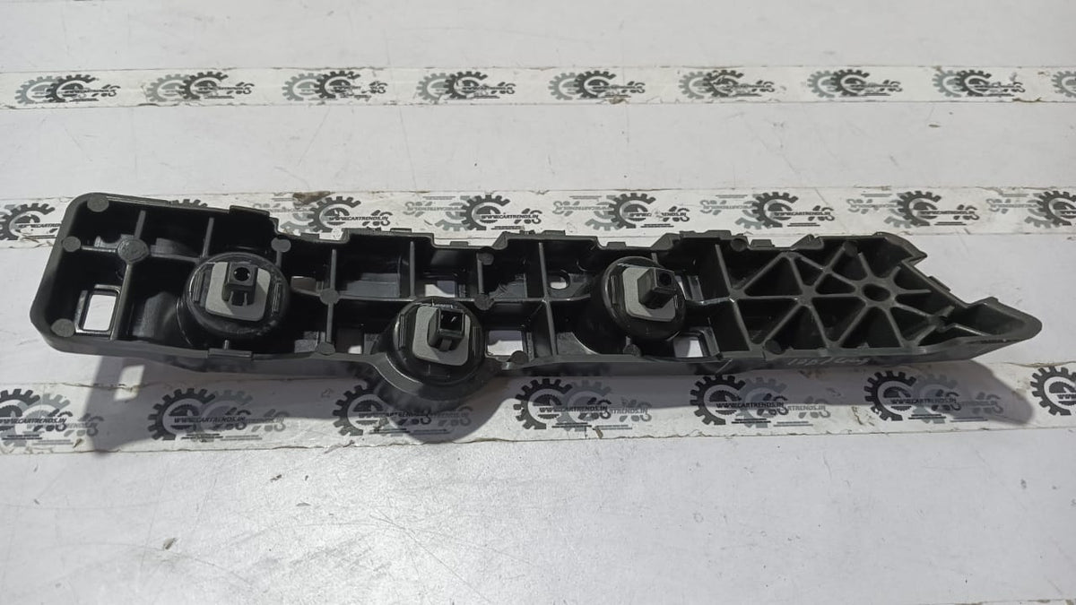 Nissan Magnite right rear bumper side panel, OEM replacement part in black, visible mounting points and design details.