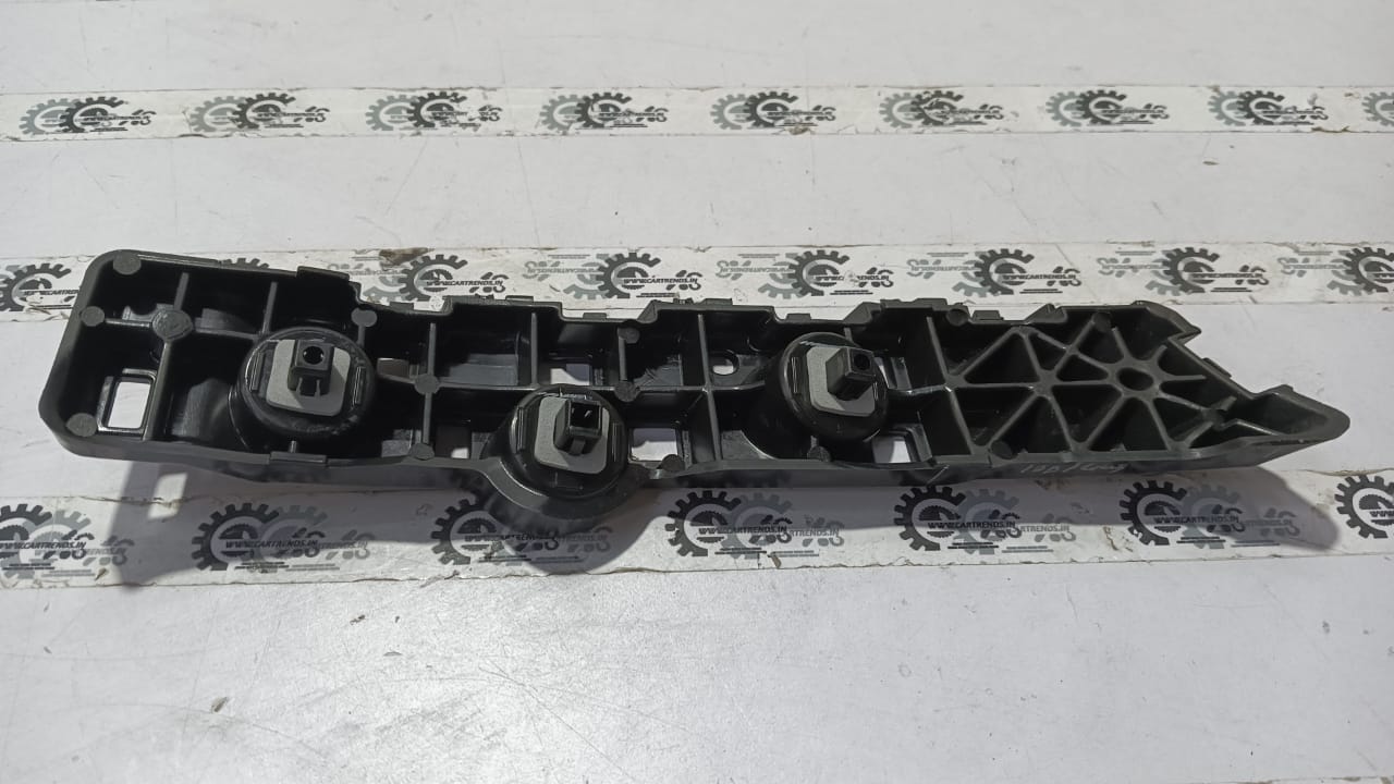 Nissan Magnite right rear bumper side panel, OEM replacement part in black, visible mounting points and design details.