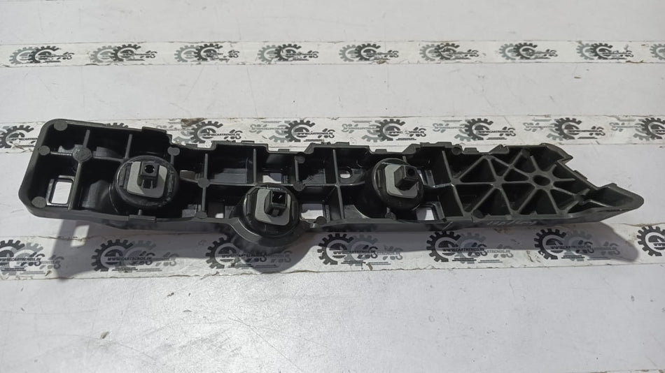 Nissan Magnite right rear bumper side panel, OEM replacement part in black, visible mounting points and design details.