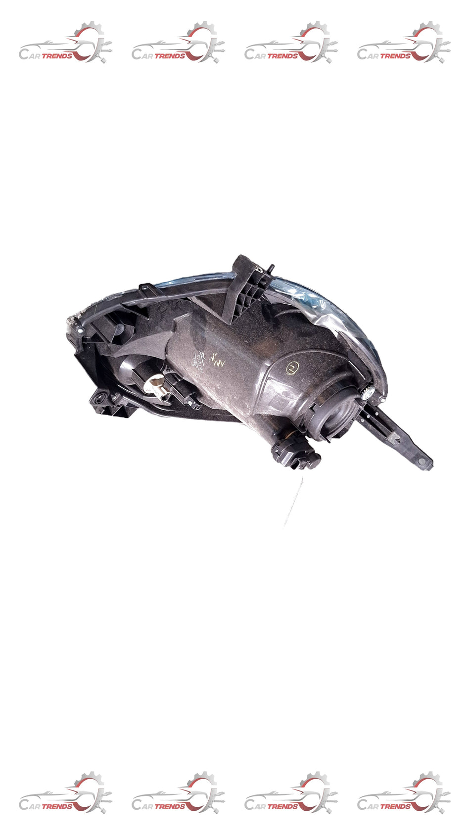 Nissan Micra active left headlight assembly, close-up view showing the lens and housing for vehicle lighting.