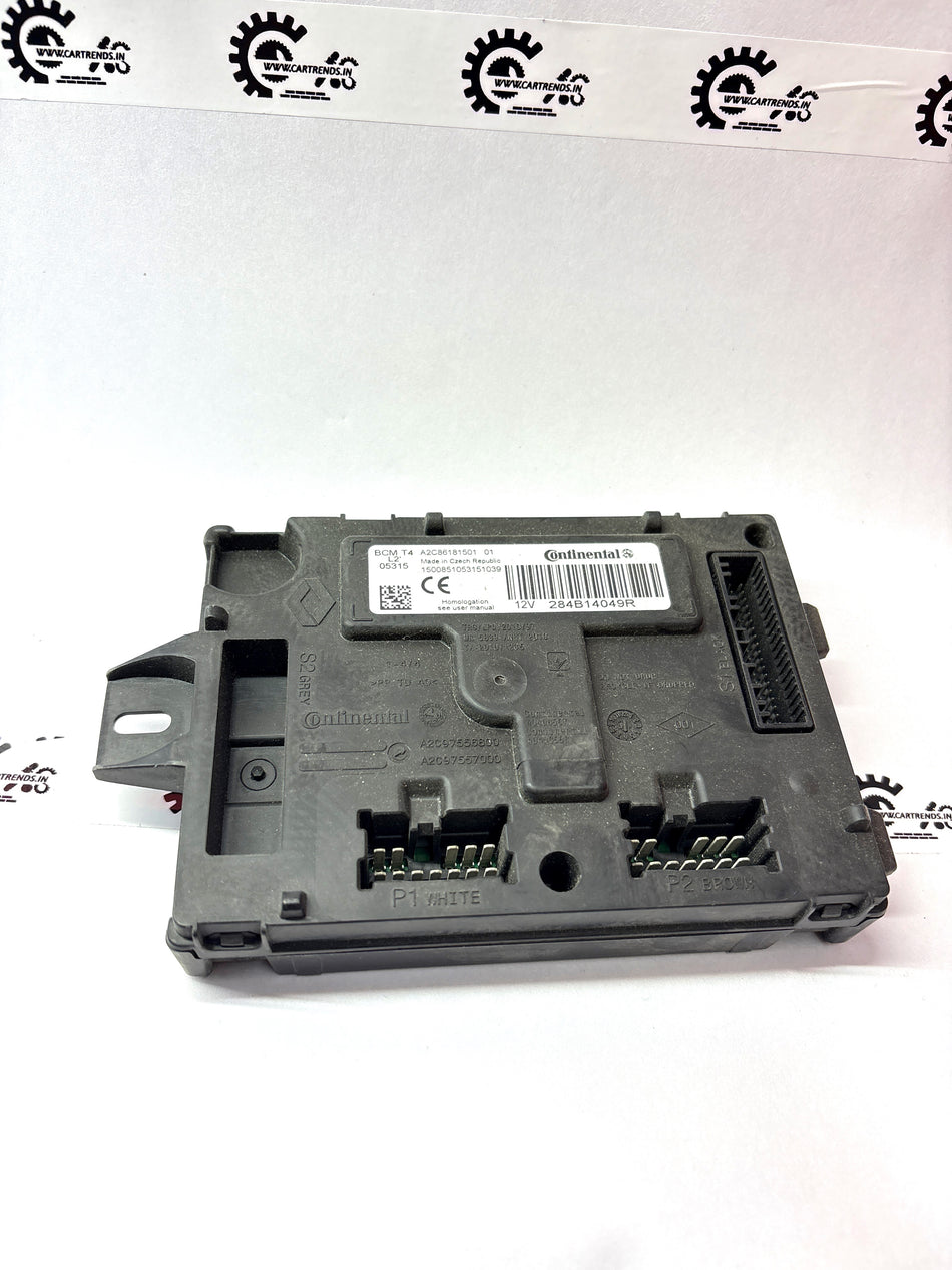 Nissan BCM controller assembly duster component, showing the black electronic module with wiring connections.