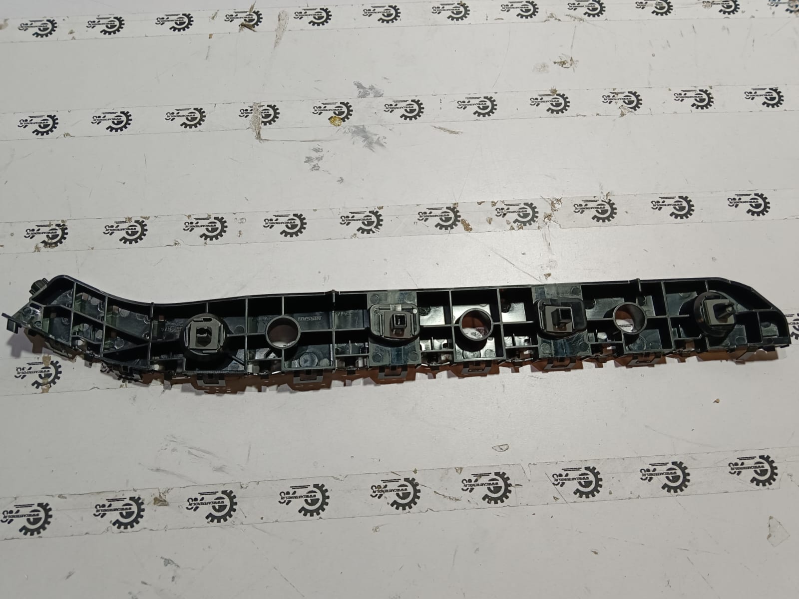 Nissan rear bumper bracket assembly for Datsun Go, rear side, with part number 852214LB0B, vehicle-mounted component.