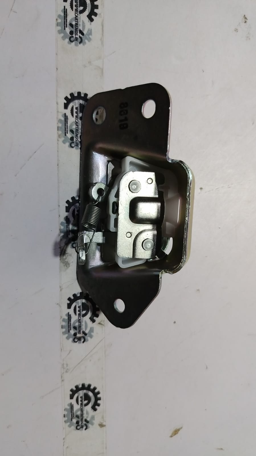 Nissan Datsun Go Dicci latch part, close-up view showing metal components and latch mechanism in detail.
