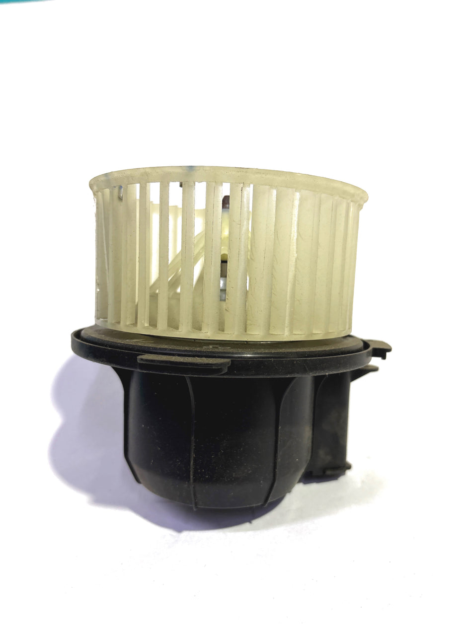 Nissan air conditioning motor fan for Renault, model #272101366R, showing the black plastic fan blade and motor assembly.