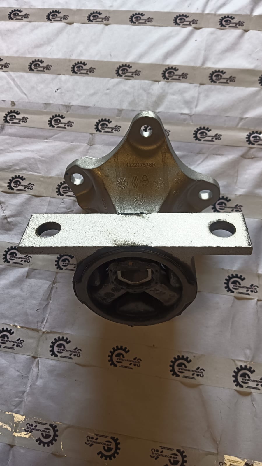 Nissan Kwid engine mounting LH part 112217518R, close-up of the engine mounting component on a white background.