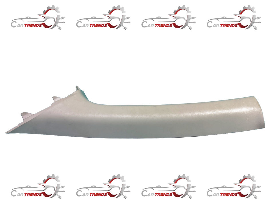 Front garnish assembly for Nissan Sunny, showing the Nissan-branded decorative trim piece with mounting details.