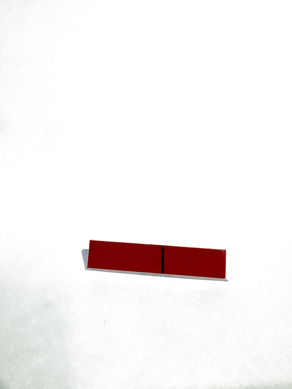 Nissan glass spacer part 727149W00A shown, made of clear glass, designed for Nissan vehicle repairs and maintenance.