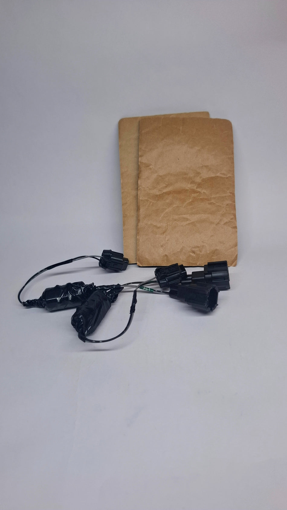 Nissan harness kit, model #240097W80A, with black wiring and connectors for vehicle electrical installation.