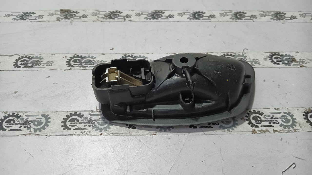 Nissan Fluence right inner door handle in black with silver trim, designed for Nissan vehicle model.