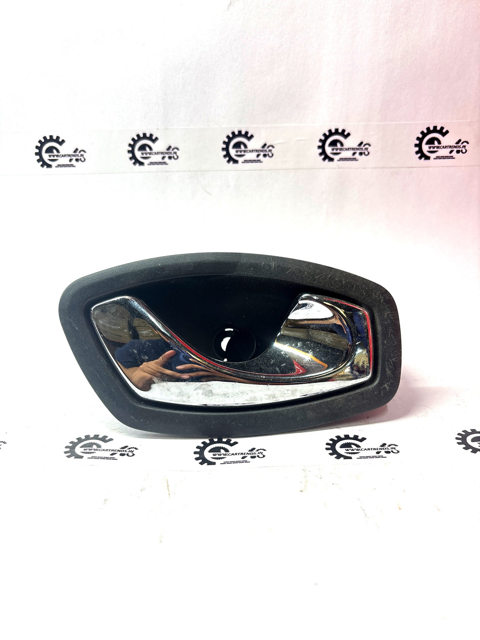 Nissan Fluence right inner door handle in black with chrome accents, designed for Nissan vehicle models.