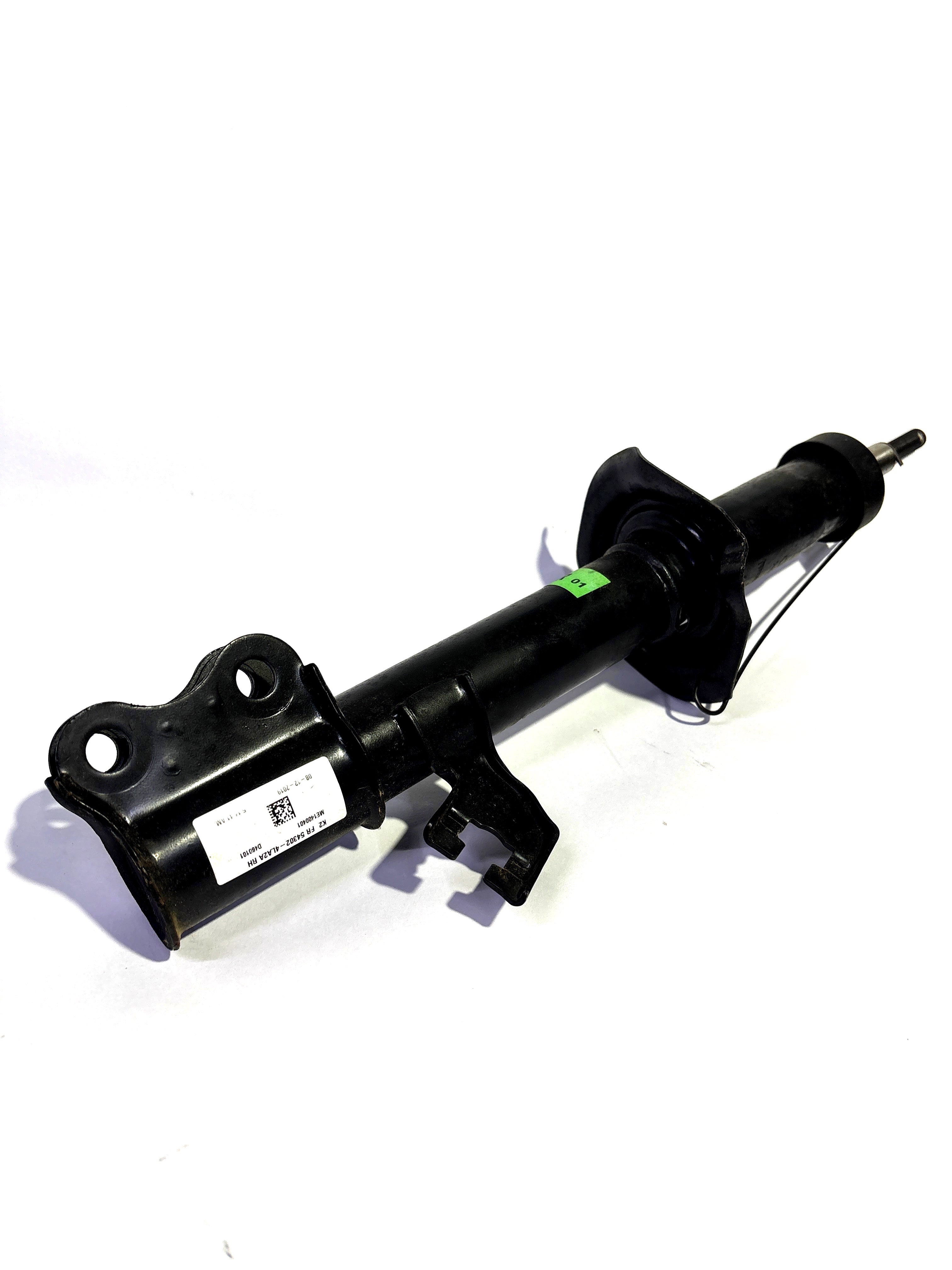 Right front shock absorber for Nissan Datsun Go, genuine Nissan part E43024LA2A, shown in a close-up image.