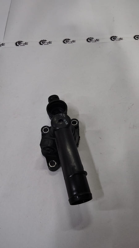 Nissan thermostat housing for Kwid model, made of durable material, with mounting points and connection ports visible.