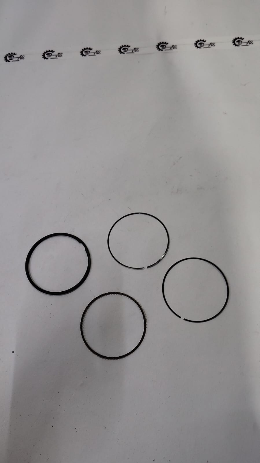 Nissan Kwid thermostat housing part number 110600318R, close-up of the black plastic engine component.