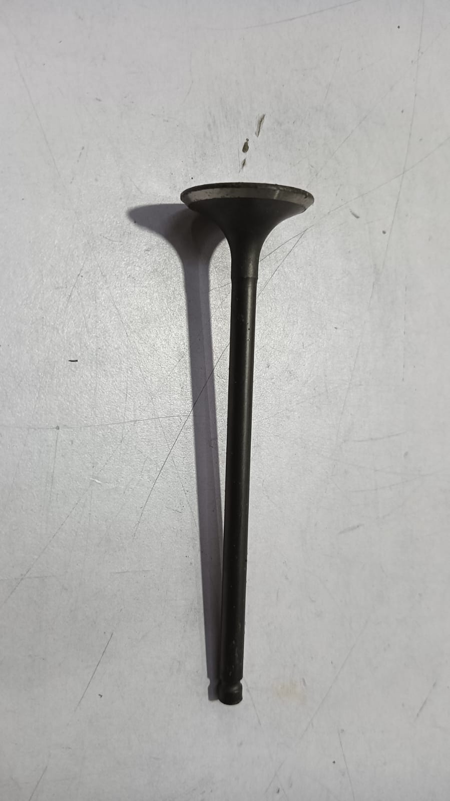 Nissan Pulse exhaust valve 13202ED00C, automotive engine component with metal construction and electronic connection.