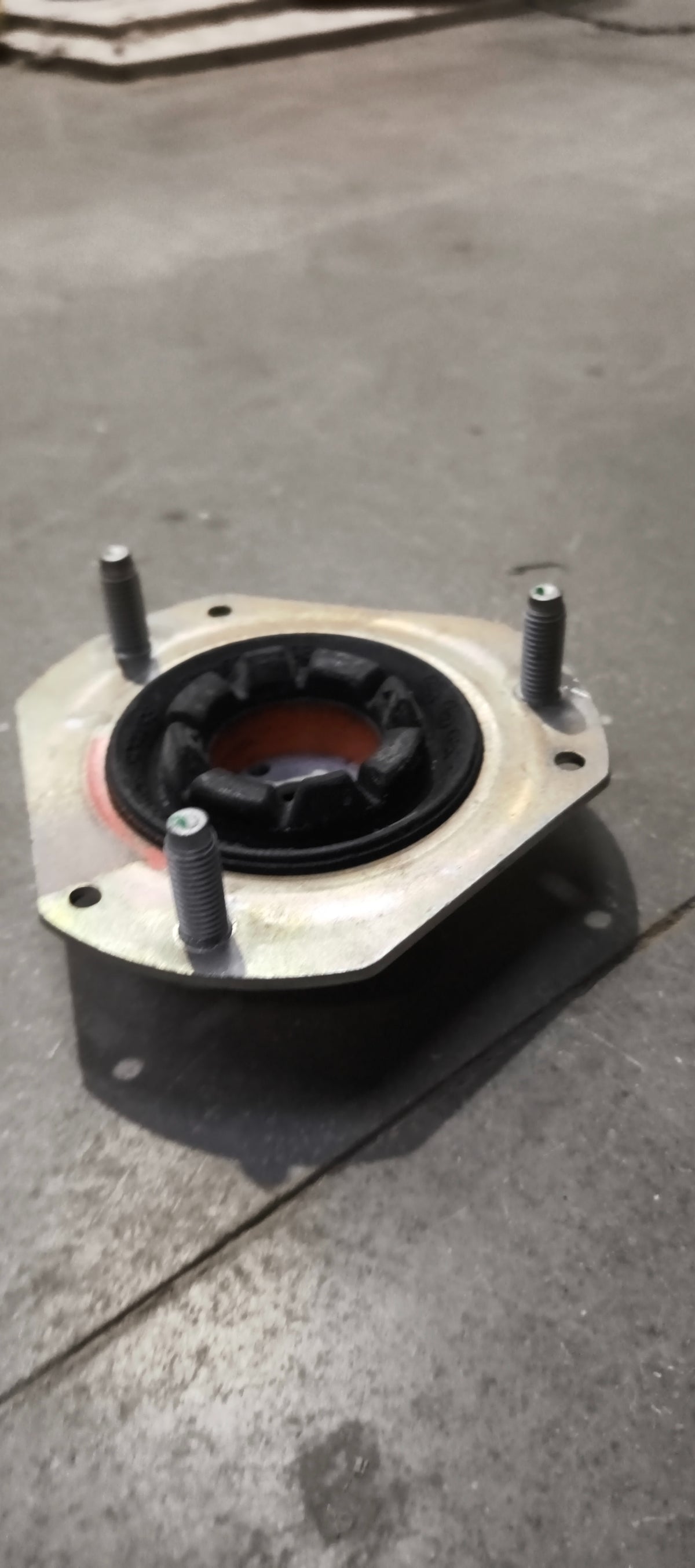 Ford E4BZ3A197A mounting assembly showing metal brackets and mounting points for vehicle installation.