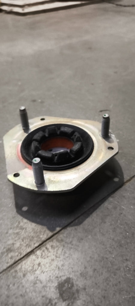 Ford E4BZ3A197A mounting assembly showing metal brackets and mounting points for vehicle installation.
