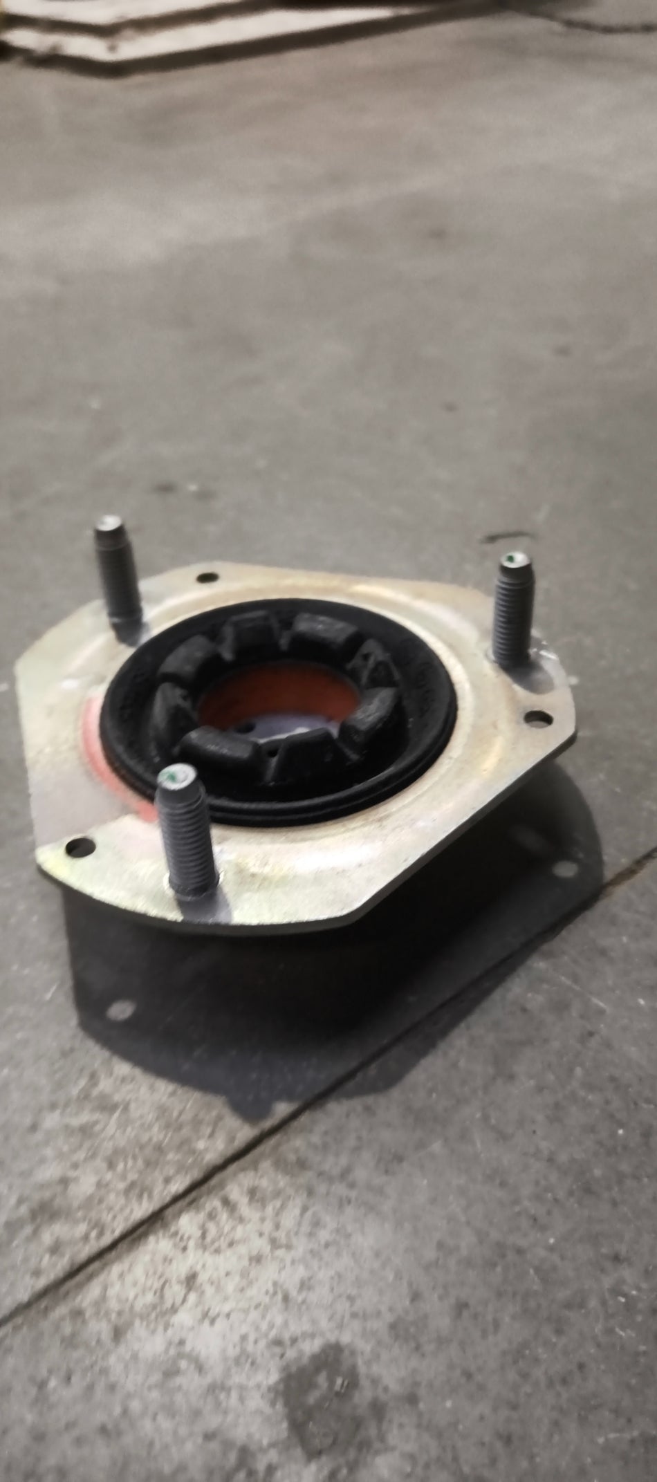 Ford E4BZ3A197A mounting assembly showing metal brackets and mounting points for vehicle installation.
