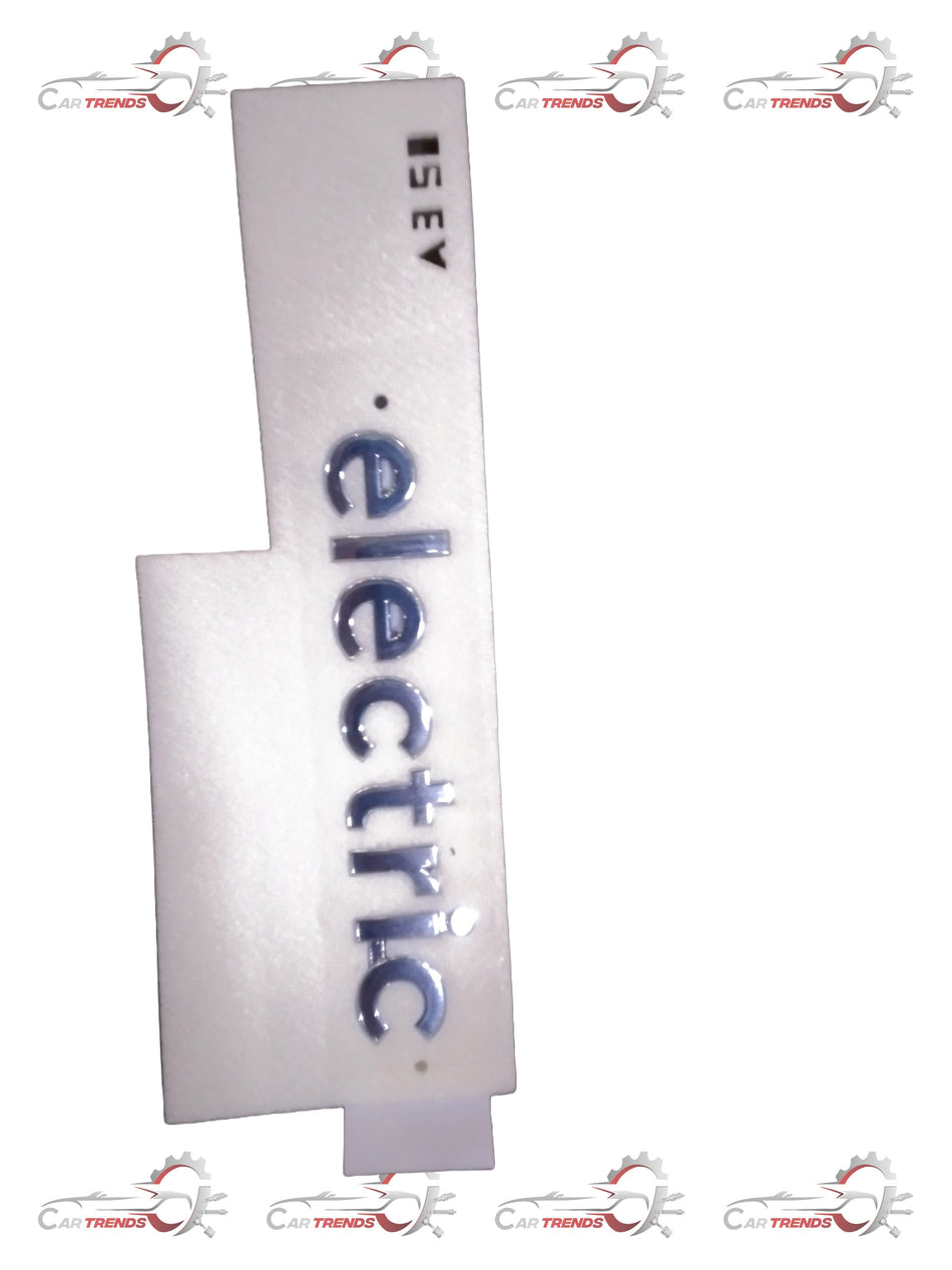 Hyundai EMBLEM-ELECTRIC 86312K4000 car emblem badge with Hyundai logo and silver finish, close-up view.