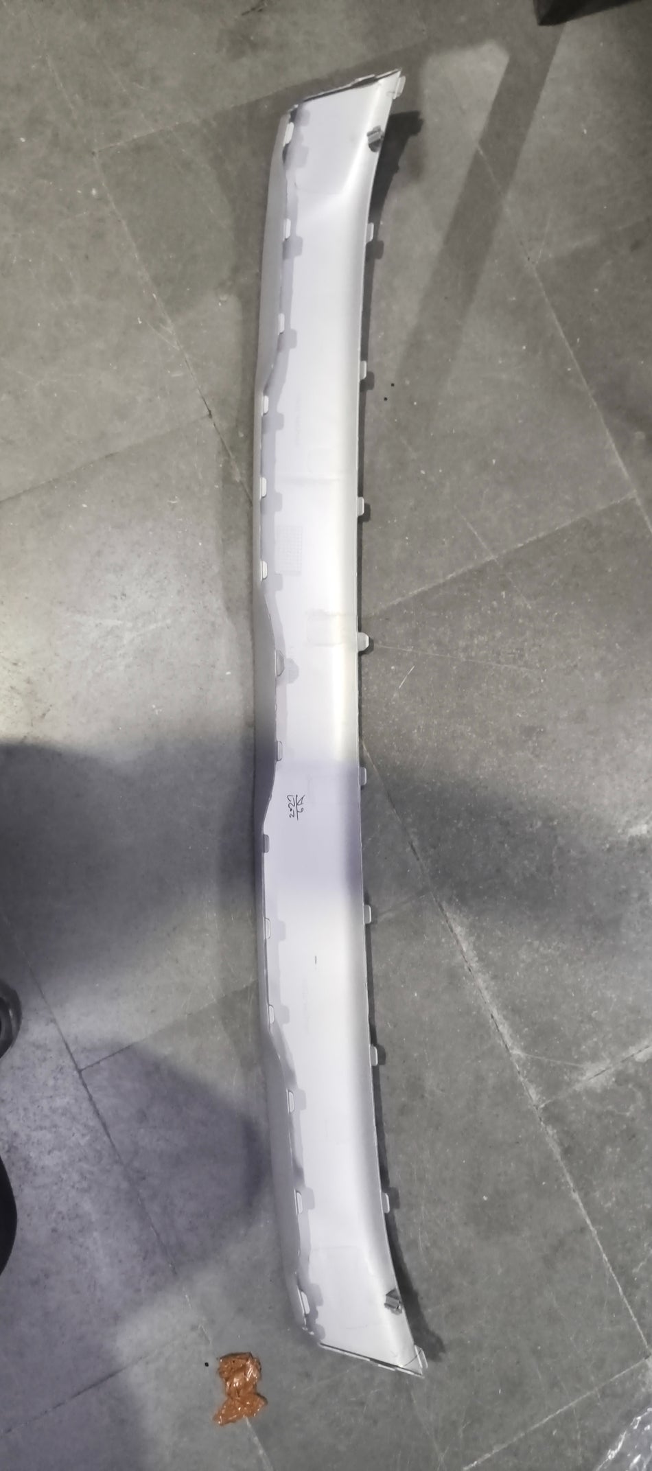 Maruti Suzuki garnish bumper lower part with product code 71771M66T10, showing the sleek, painted bumper section.
