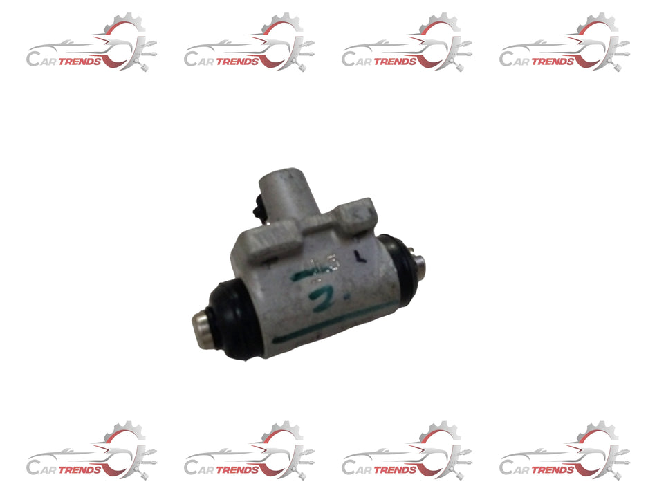 Maruti Suzuki rear brake cylinder assembly for left-hand side, with visible metal components and hydraulic connection.