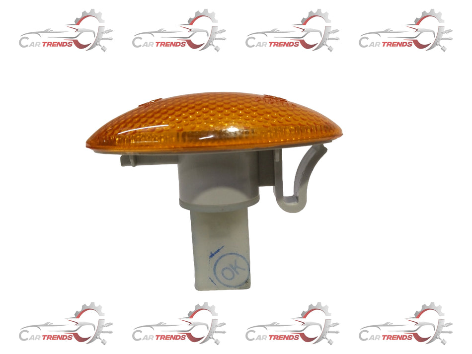 Maruti indicator light A Star Orange by CarTrends, showing a close-up of the bright orange indicator light on a vehicle.