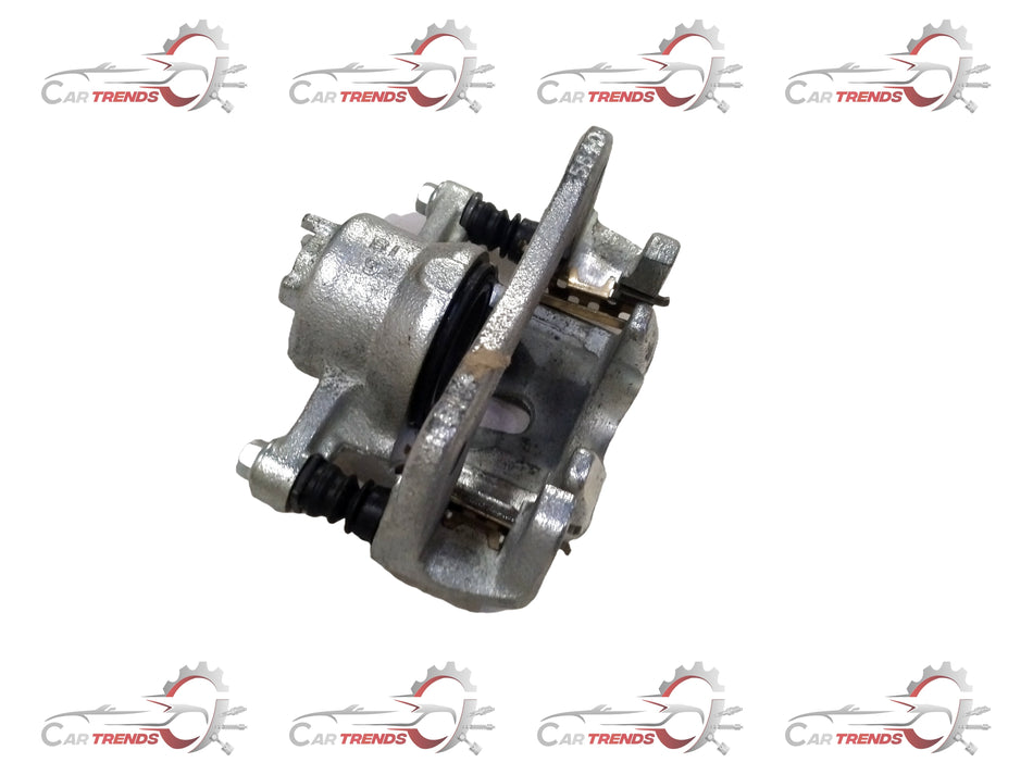 Maruti Suzuki front brake caliper assembly, part number 55101M81R00, showing the metal caliper with brake pads attached.
