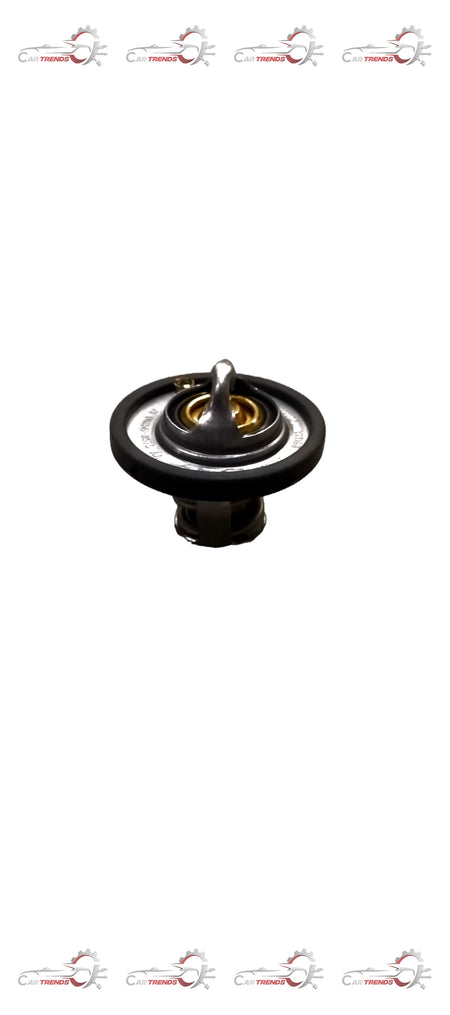 Ford DM5G8575AA thermostat assembly showing the metal housing and internal components for vehicle climate control.
