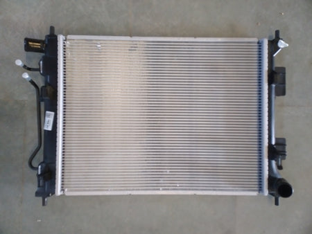 Hyundai 253100u050 radiator for petrol Xcent, new model, showing the metal core and inlet/outlet connections.