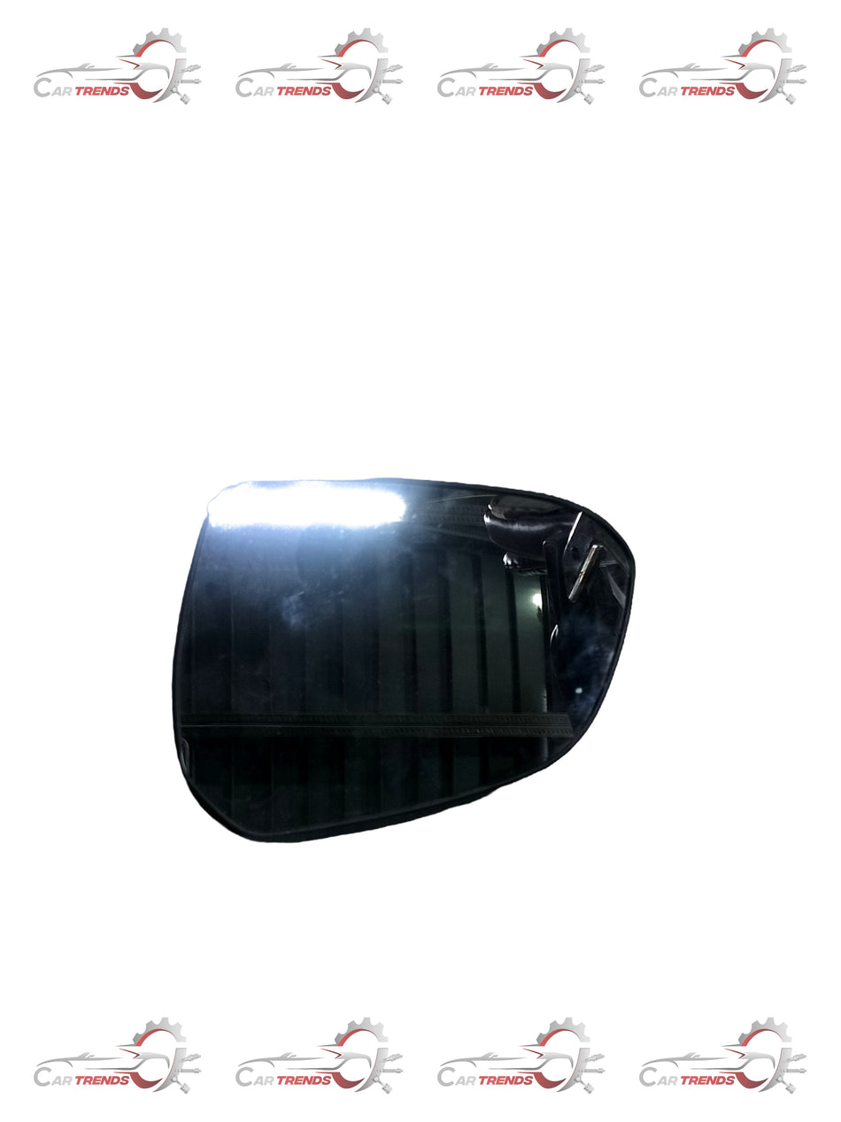 Hyundai I10 Grand left side mirror glass replacement by CarTrends showing reflective surface with mounting edges