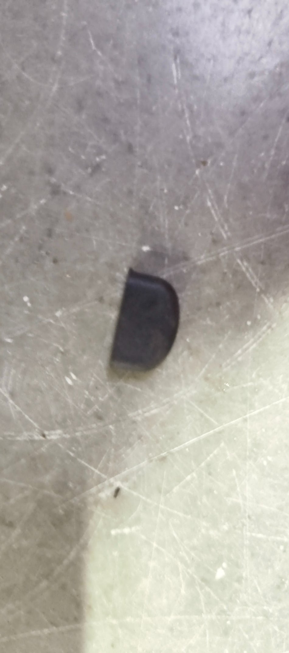 Maruti Suzuki Cushion Fuel Lid 77116M74L00 for fuel tank opening, made of durable plastic, black color, vehicle part.