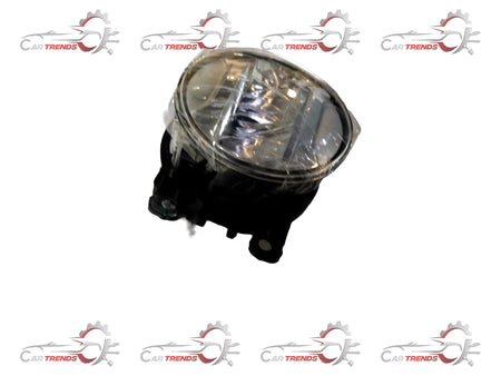 Maruti Suzuki fog lamp assembly with clear lens and black housing, designed for vehicle lighting and safety.
