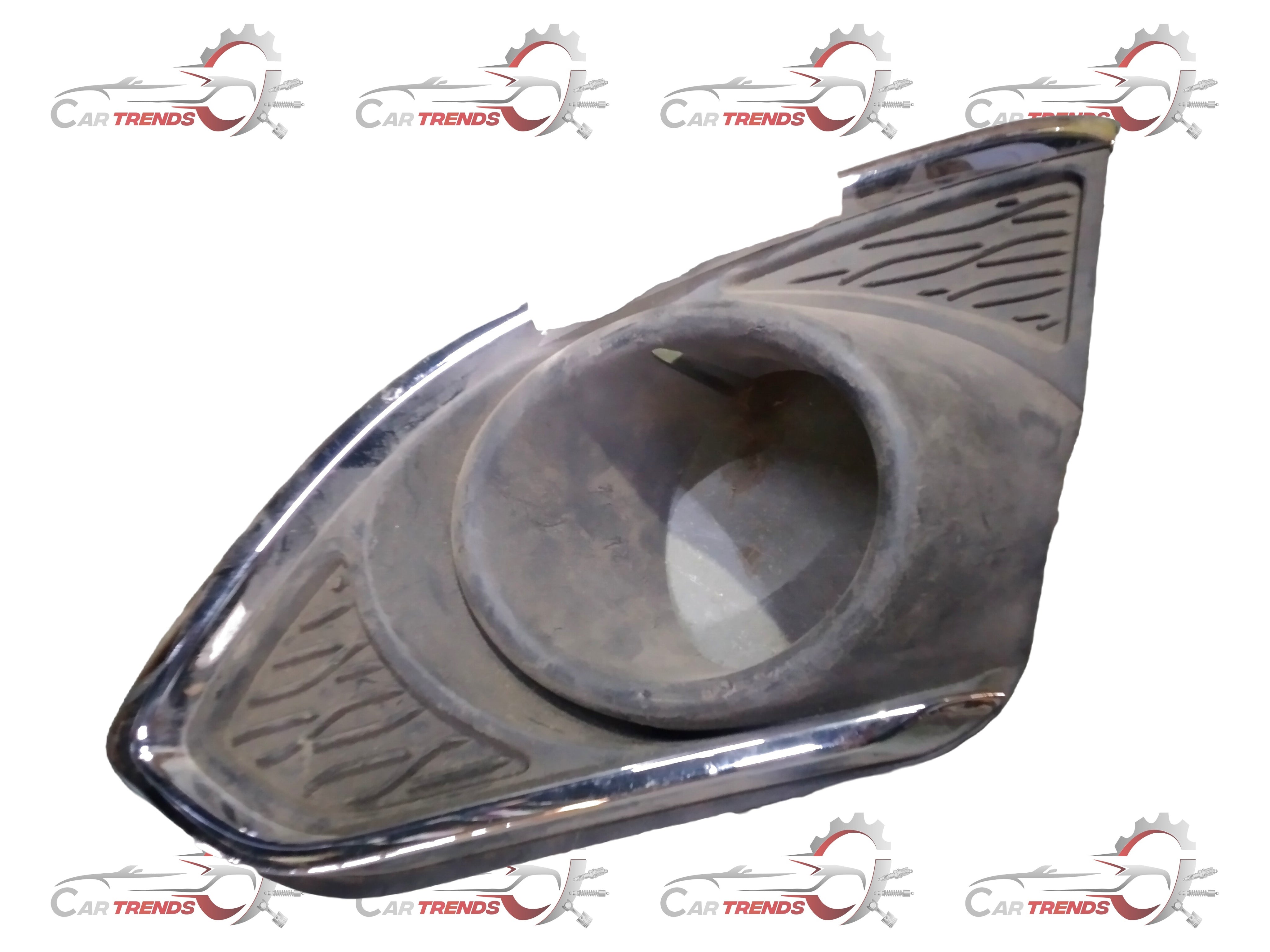 CarTrends front fog light bezel cover for Beat J95214496, showing the plastic part with a sleek finish and mounting features.