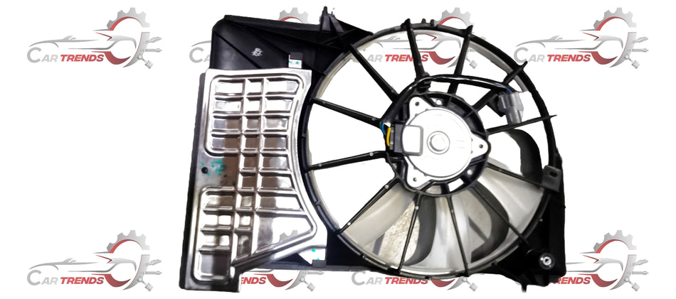Maruti Suzuki Baleno fan assembly part 17100M54T00 showing the metal fan blades and motor components.