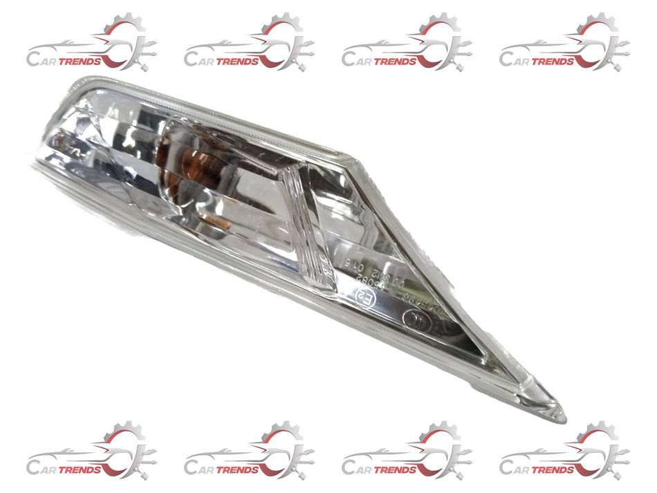 Honda light assembly side turn right, shows the clear lens and mounting bracket for the vehicle's right-side turn signal.